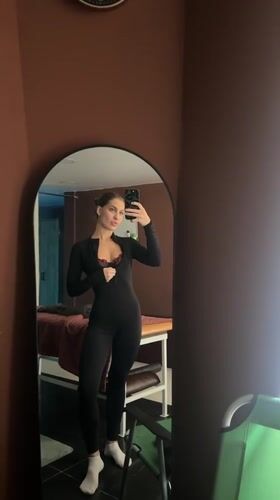 Woman takes mirror selfies in Irkutsk indoor location