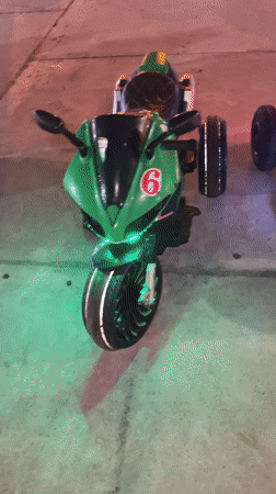 Electric toy cars line outdoor plaza in Mui Ne