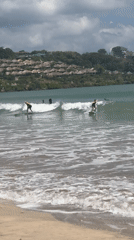 Early morning surfing session captured at Kuta Selatan beach