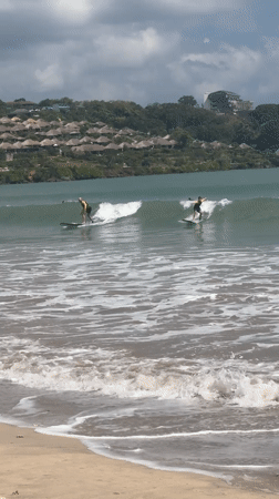 Early morning surfing session captured at Kuta Selatan beach