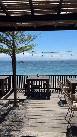 Serene beachside restaurant scene captured in Nusa Penida