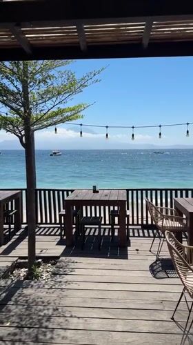 Serene beachside restaurant scene captured in Nusa Penida