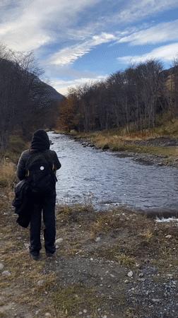 Ushuaia residents document river scene, construction equipment