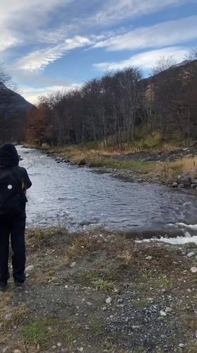 Ushuaia residents document river scene, construction equipment
