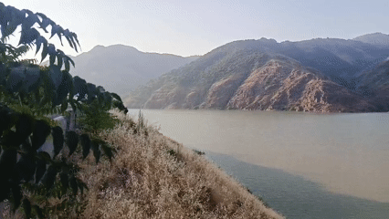 Train ride through a dramatic mountain river valley