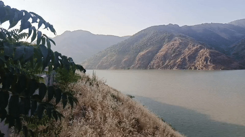 Train ride through a dramatic mountain river valley