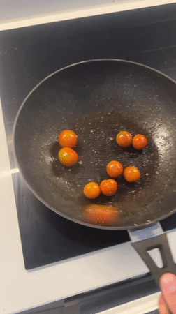Cherry tomatoes cooked in frying pan in London