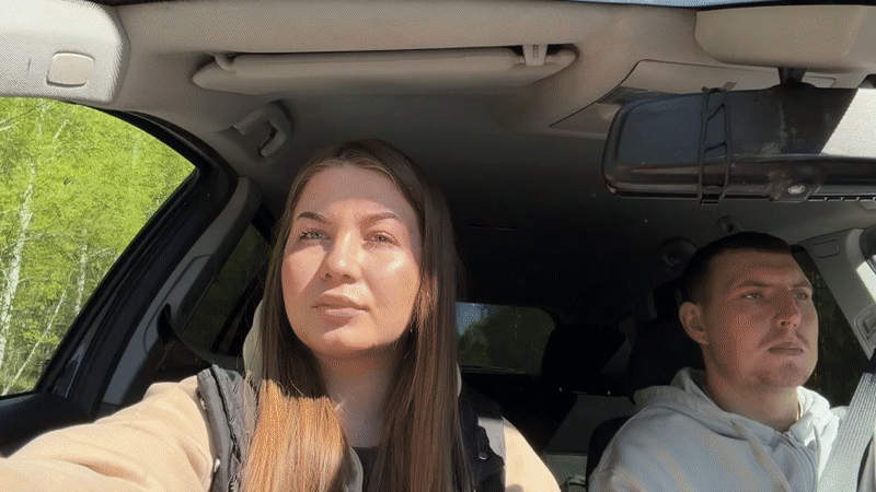 Couple observed in casual moment inside vehicle in Zhigalki