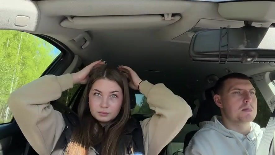 Couple observed in casual moment inside vehicle in Zhigalki