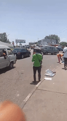 Daytime street activity captured near Lutheran Church in Jos