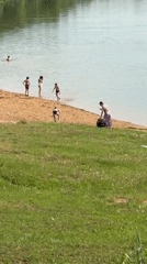 Beachgoers enjoy sunny day at Novosinkovo lake