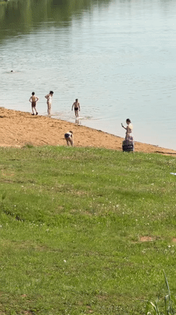 Beachgoers enjoy sunny day at Novosinkovo lake