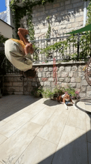 Man and dog share quiet morning moment on Montenegro patio