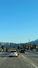Traffic stops at red light on Palm Springs street