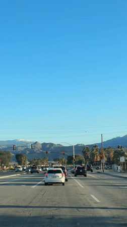 Traffic stops at red light on Palm Springs street