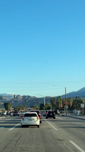 Traffic stops at red light on Palm Springs street