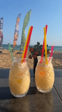 Pineapple cocktail glasses on a dark surface in Manavgat