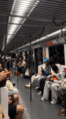 Lyon subway passengers use phones during afternoon commute