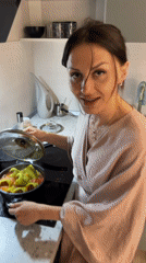 Person prepares stuffed peppers in Murino, Russia
