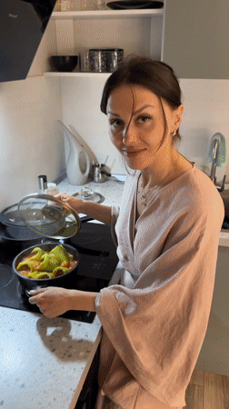 Person prepares stuffed peppers in Murino, Russia