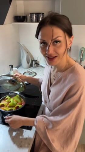 Person prepares stuffed peppers in Murino, Russia