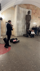 Evening street music and wet roads observed in Moscow