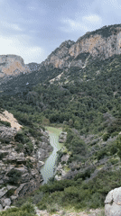 Tourist documents scenic gorge views near Ardales, Spain