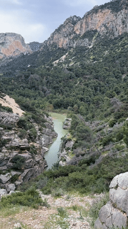 Tourist documents scenic gorge views near Ardales, Spain