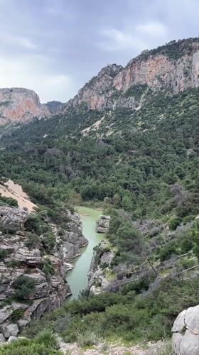 Tourist documents scenic gorge views near Ardales, Spain