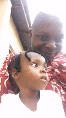 Casual outdoor moment with a child in Zango-ndaji, Nigeria