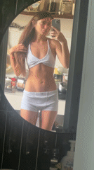 Woman Takes Early Morning Selfies in Apartment