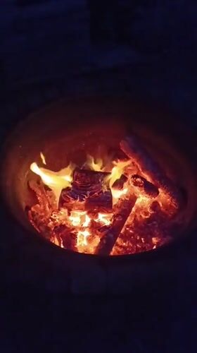Quiet Evening Moments Documented Around Backyard Fire in Viadana