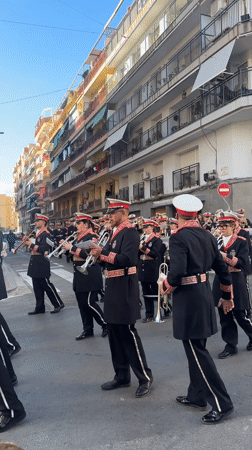 Religious procession with ornate floats parades through Alicante streets