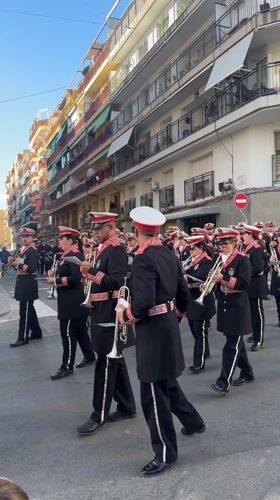 Religious procession with ornate floats parades through Alicante streets