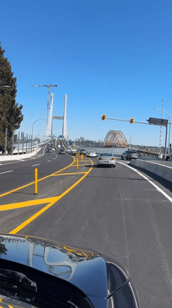 Traffic flows normally across Pattullo Bridge area during sunny day