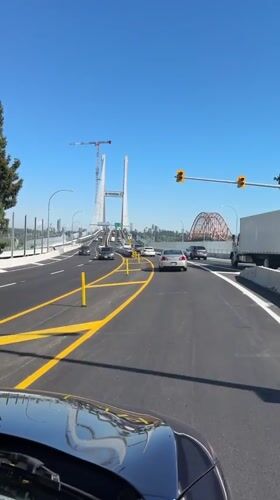 Traffic flows normally across Pattullo Bridge area during sunny day