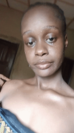 Young woman photographed in Akwanga, Nigeria appears damp