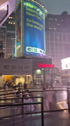 A rainy summer evening moving through Midtown Manhattan
