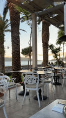 Golden hour dining scene captured at Montenegro beachside cafe