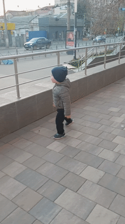 Toddler spotted walking on Simferopol sidewalk