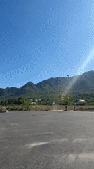 Sunny mountain road scene captured in Nam Nha Trang Ward