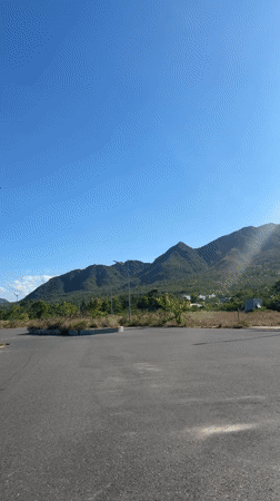 Sunny mountain road scene captured in Nam Nha Trang Ward