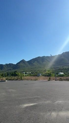 Sunny mountain road scene captured in Nam Nha Trang Ward