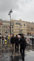 Rainy morning documented across central Saint Petersburg streets and metro