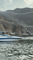 Decorated yacht cruises Ancón waters with colorful balloons