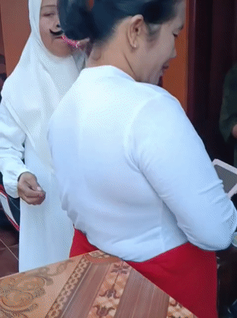 Traditional costume parade prep underway in a Tasikmalaya neighborhood