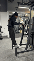 Person exercises on gym equipment in London