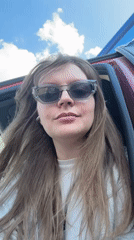 Woman photographed smiling in car in Izhevsk, Russia