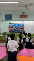 Students watch classroom television during morning session in Ho Chi Minh City