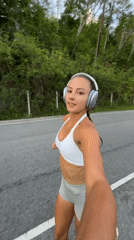 Woman jogs while filming herself in Chalong, Thailand